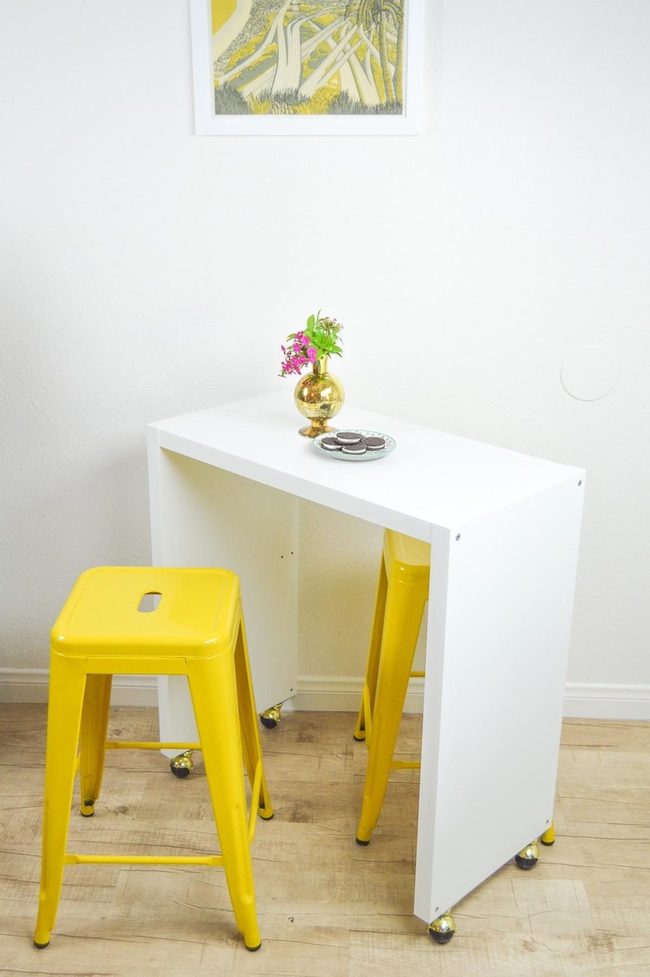 Yellow Stools Brighten Compact Dining
