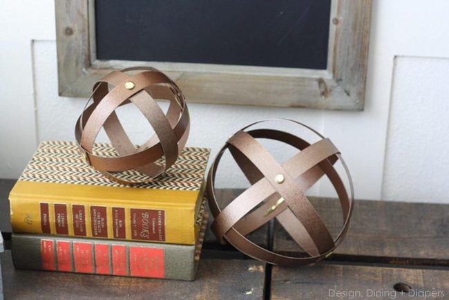 Weathered Wood Meets Bronze Spheres