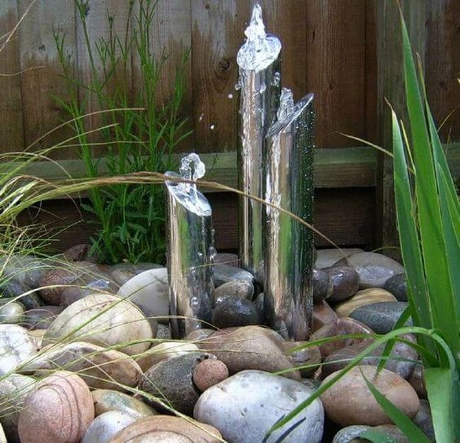 Polished Metal Fountain With River Stones