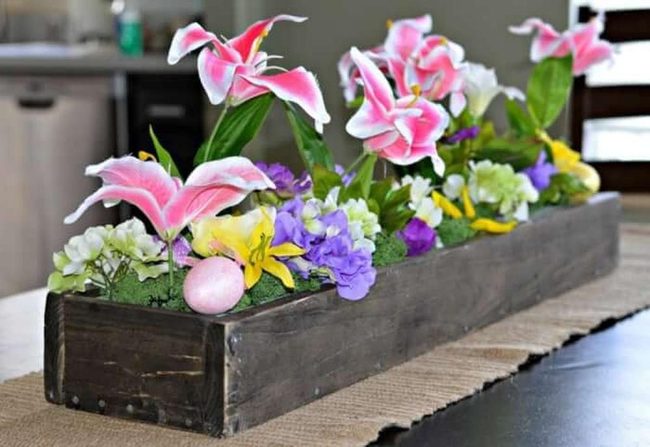 Pink And Yellow Flowers In Wood