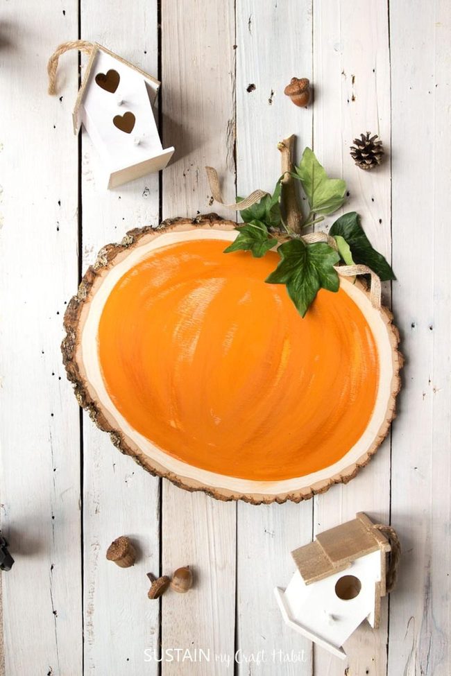 Stacked Orange Pumpkins On Weathered Wood