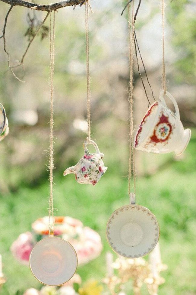 Porcelain Teacups Suspended From Branches