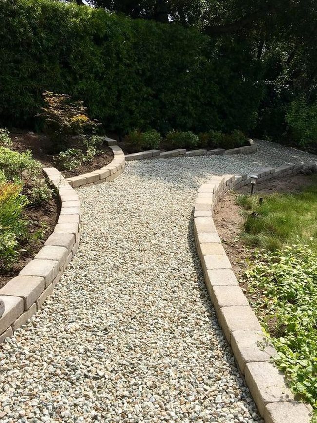 Curved Stone Path Through Green Canopy