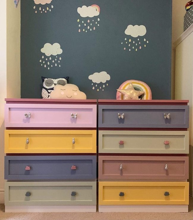 Clouds And Raindrops Over Pastel Drawers