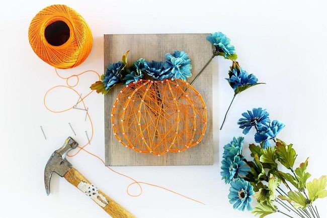Orange Thread Pumpkins On Wood