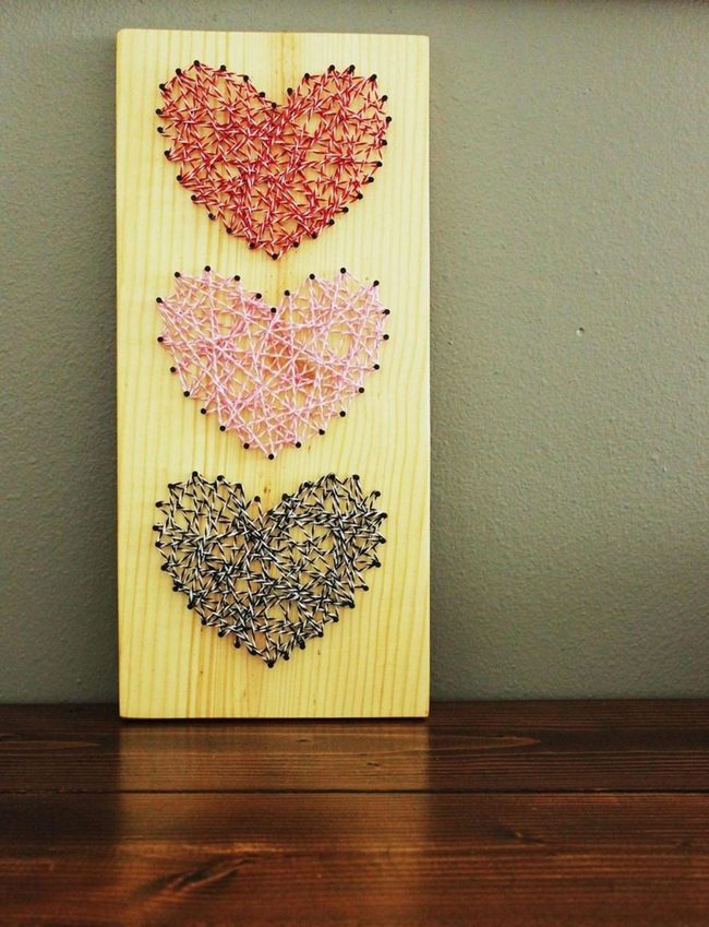 Colorful Threads On Wooden Hearts
