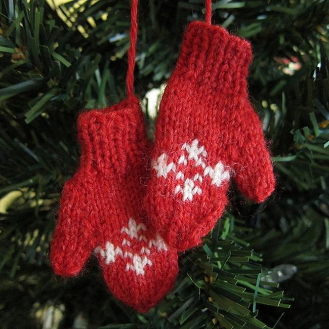 Red Mittens Against Winter Green