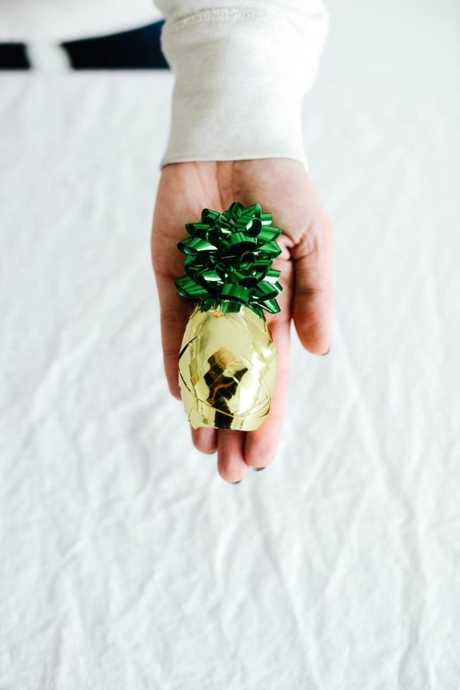Golden Gift With Green Bow