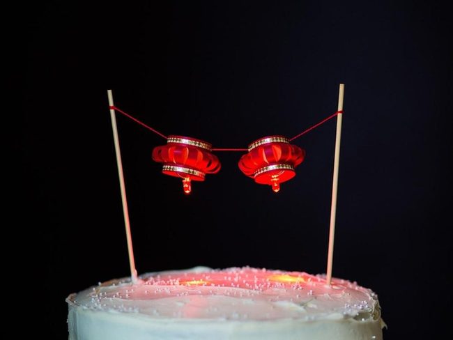 Red Lanterns Over White Frosting