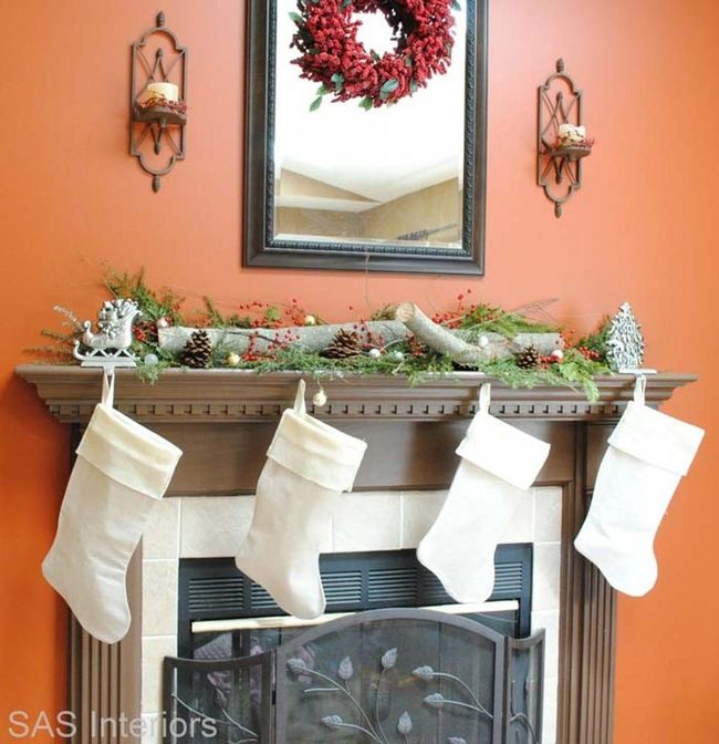 Stacked Logs With Holly And Greenery
