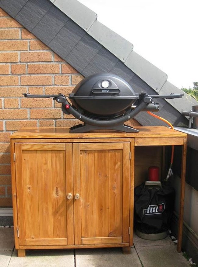 Black Grill On Wood Cabinet