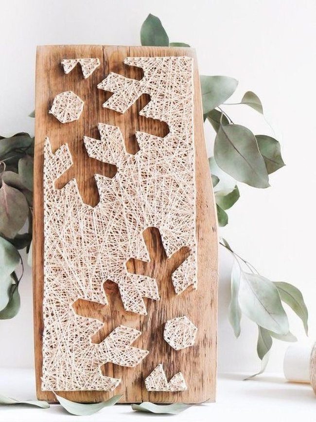 White String Snowflakes On Wood