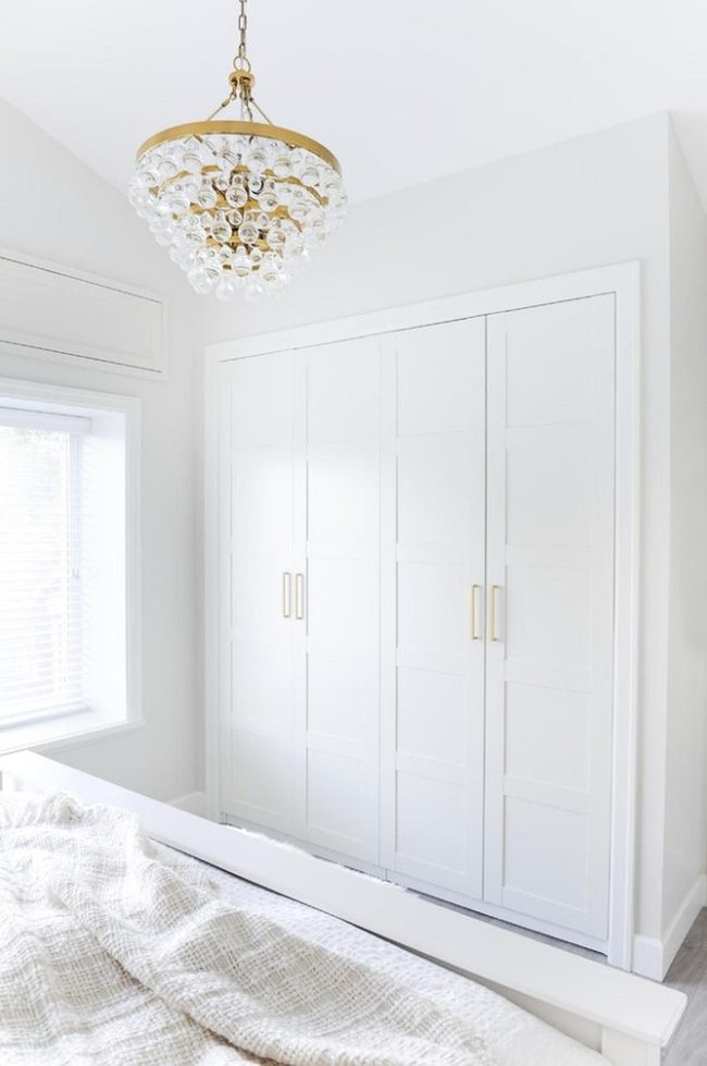 Sunlit White Bedroom With Gold Accents