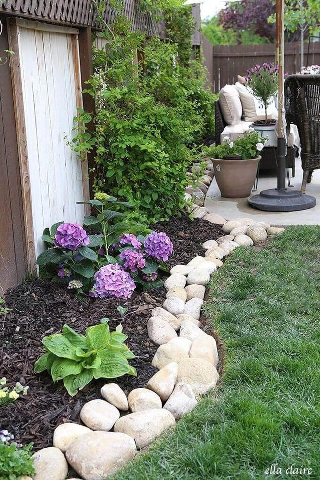 Stone Boundaries And Blooming Gardens