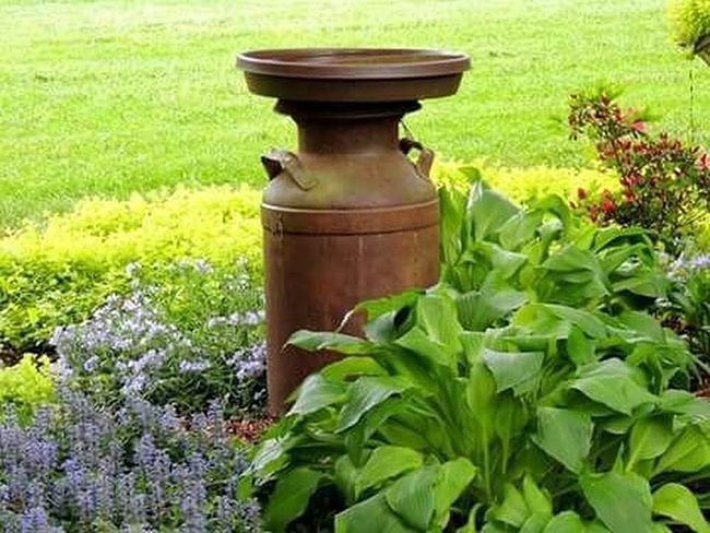 Rusty Metal Jugs Garden Planters