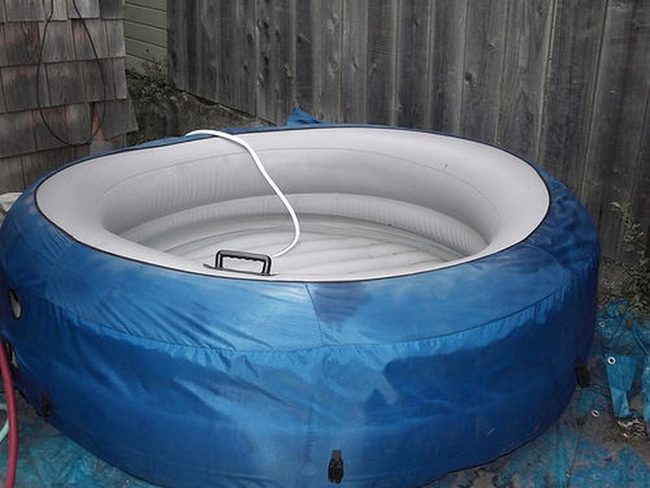 Blue Inflatable Tub With Wooden Fence