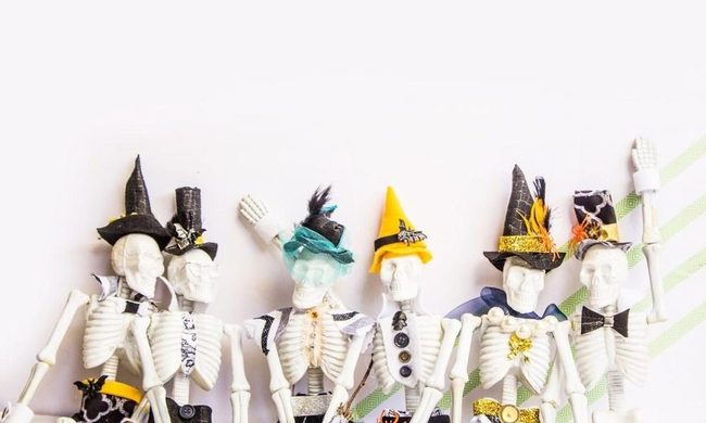 Skeleton Figures In Bold Costumes