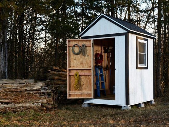 Black-Roofed Storage Shed White Walls