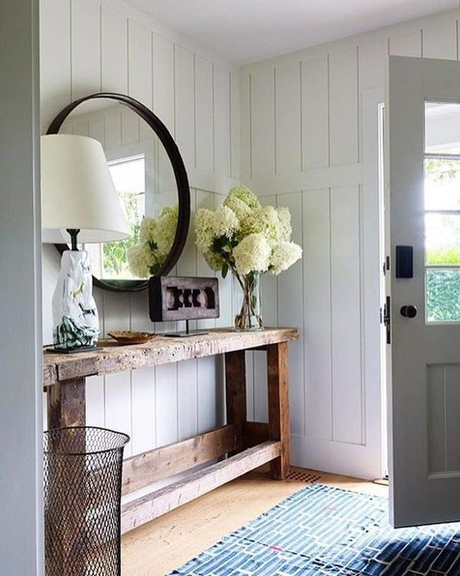 White Paneled Entry With Blue Patterned Rug