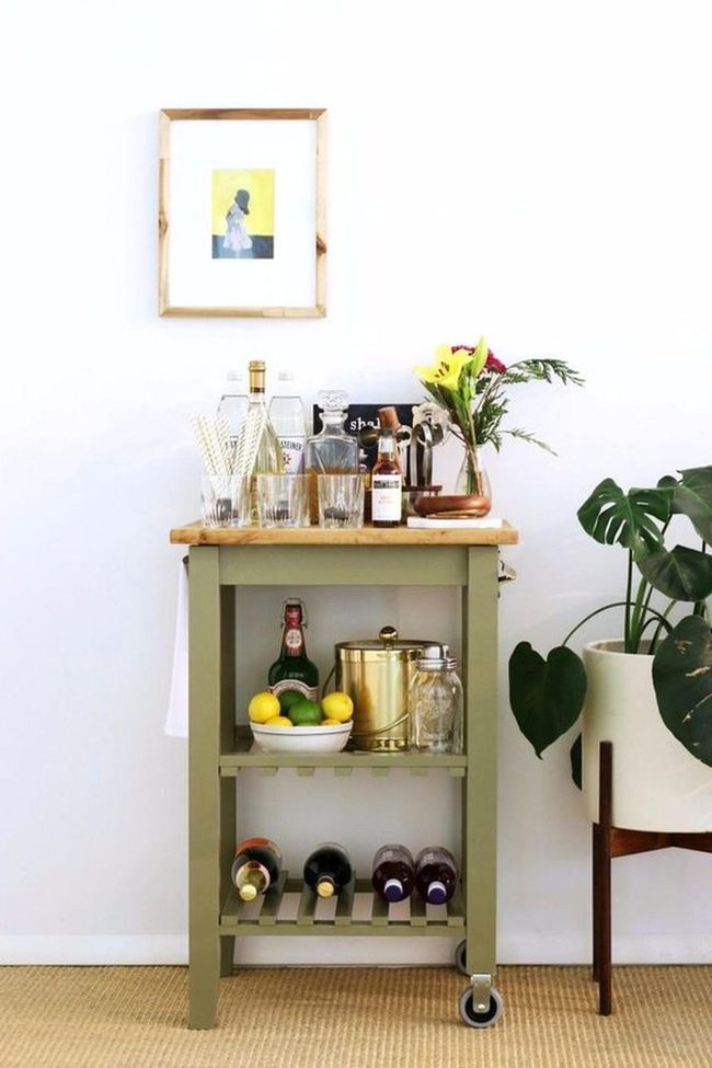 Green Bar Cart With Citrus And Bottles