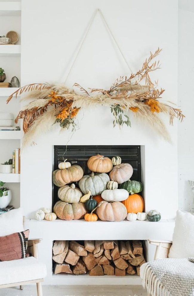 Autumn Pumpkins And Stacked Firewood