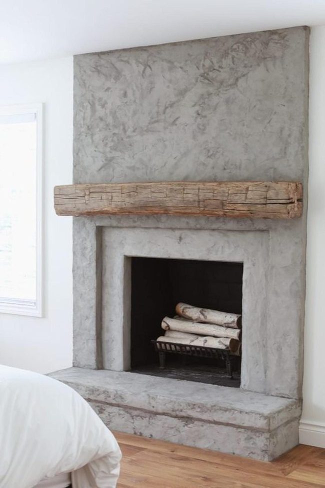 Concrete Gray Fireplace With Timber Beam