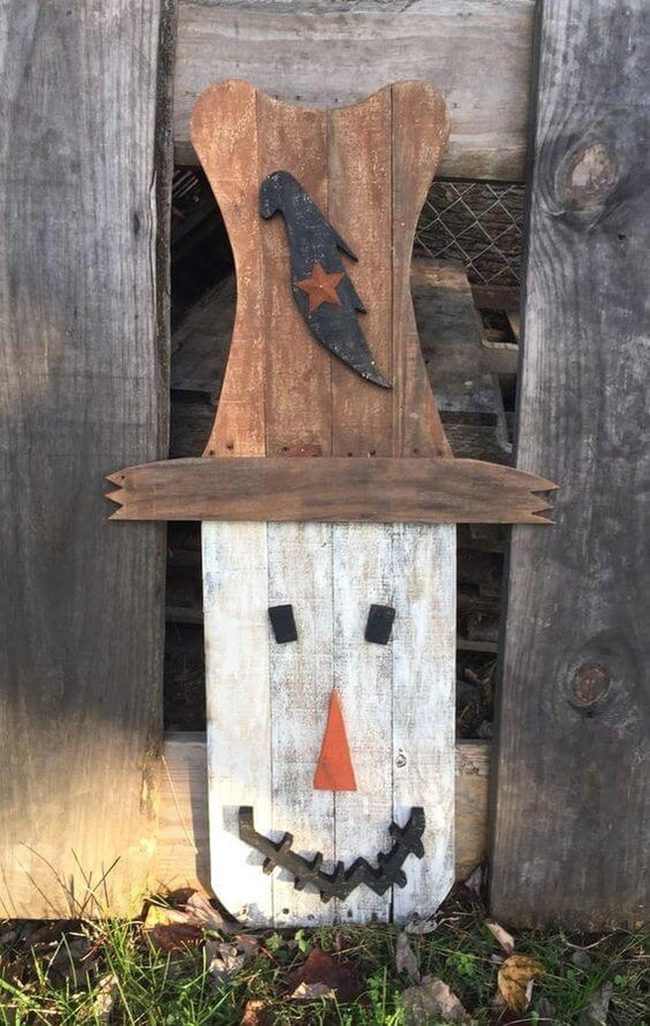 Wooden Scarecrow With Painted Smile