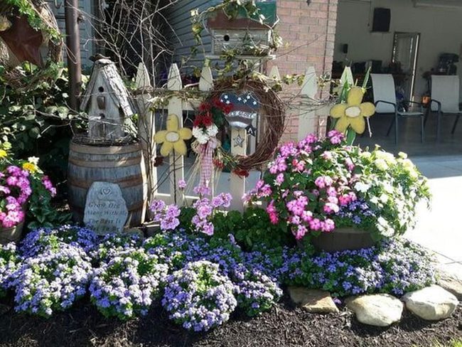 Flowers Bursting From Salvaged Containers
