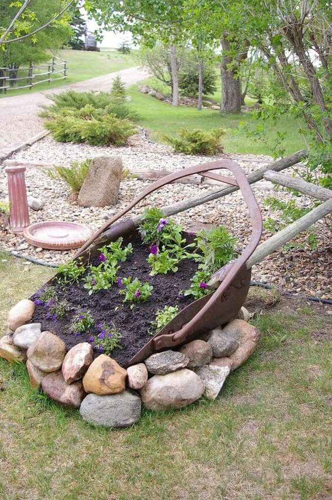 Wheelbarrow Blooms Stone Border