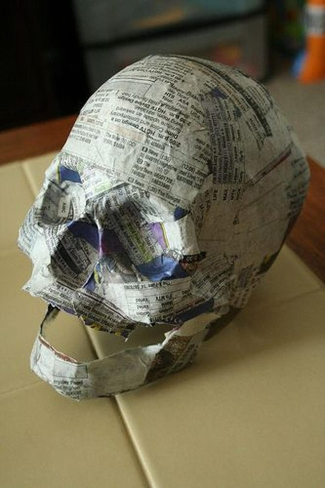 Layered Newspaper Skull Sculpture