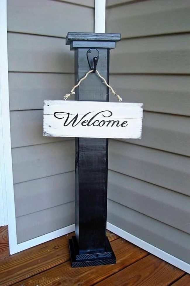 Black Post White Welcome Sign