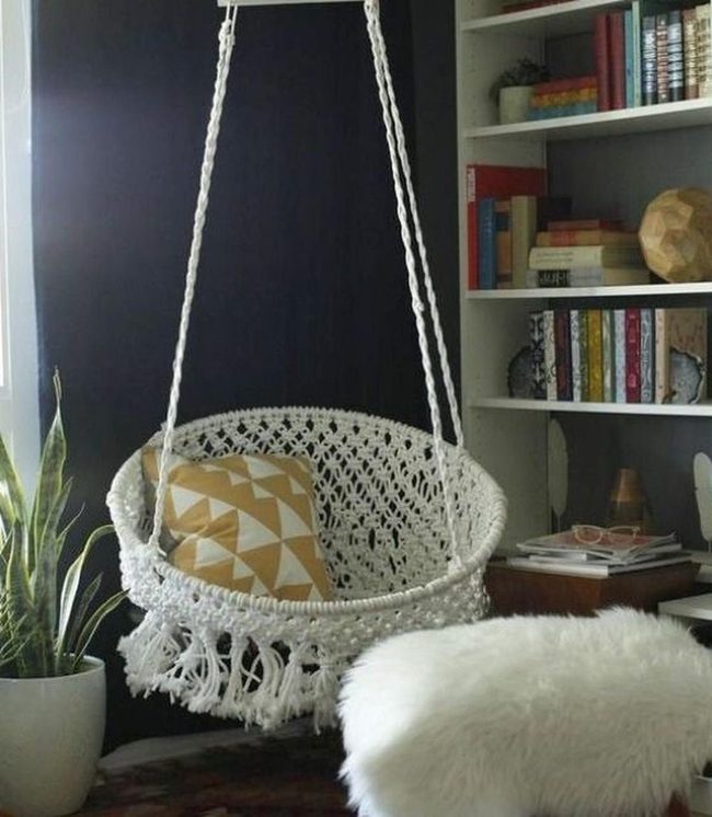White Hanging Chair With Yellow Triangle Pillow