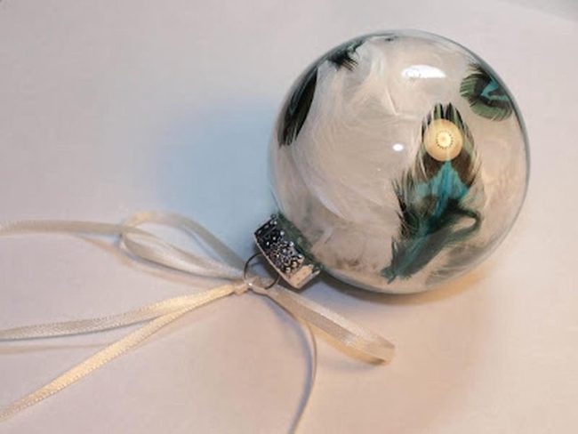 White Feathers In Clear Glass Sphere