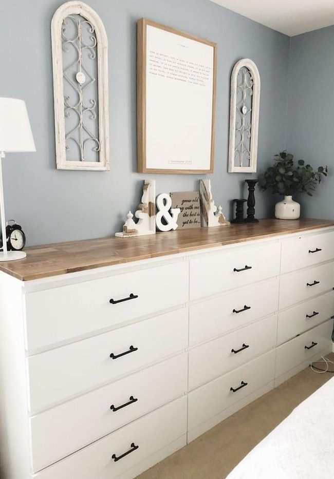 White Dresser Against Blue Walls