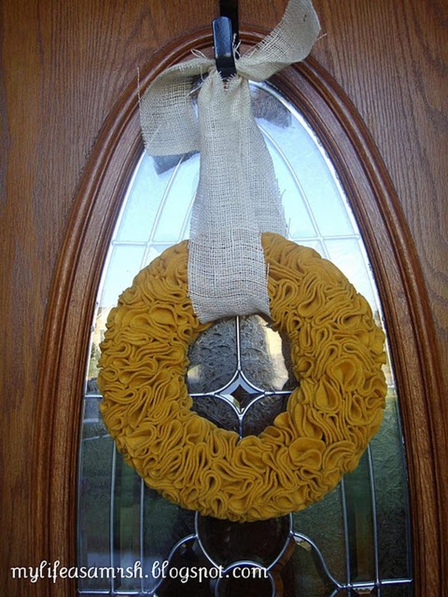Patterned Glass Door With Warm Wood And Yellow Fabric Wreath