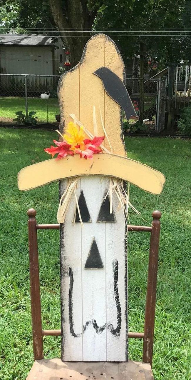 Wooden Scarecrow With Cascading Leaves