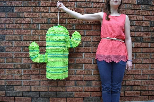 Green Cactus Piñata Brick Wall