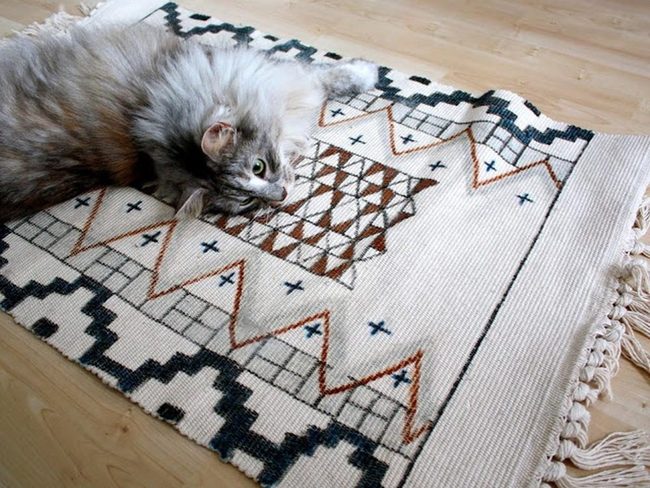 Geometric Brown Rug With Woven Triangles
