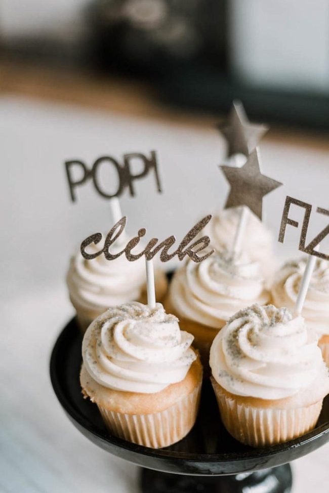 White Frosted Cupcakes With Comic Pop