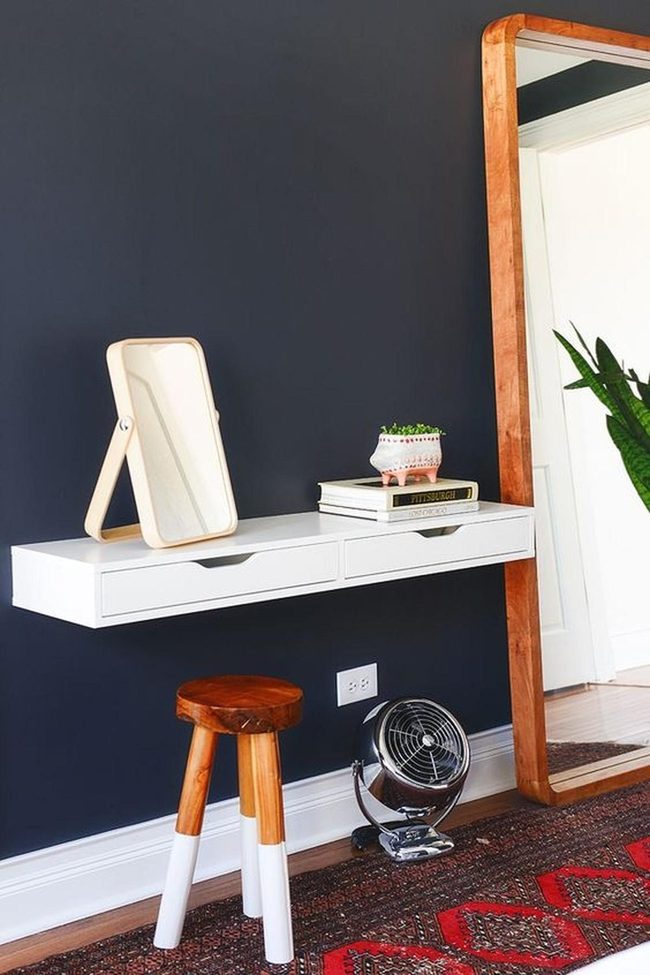 White Floating Desk With Dark Wall Mirror