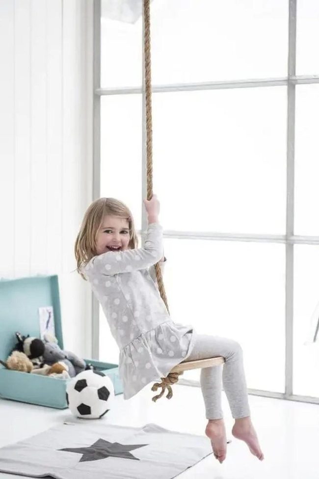 Sunlit Grey Playroom With Teal Storage