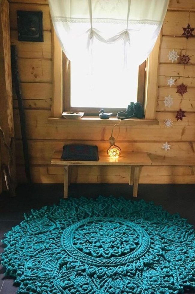 Teal Patterned Rug Anchors Wooden Room