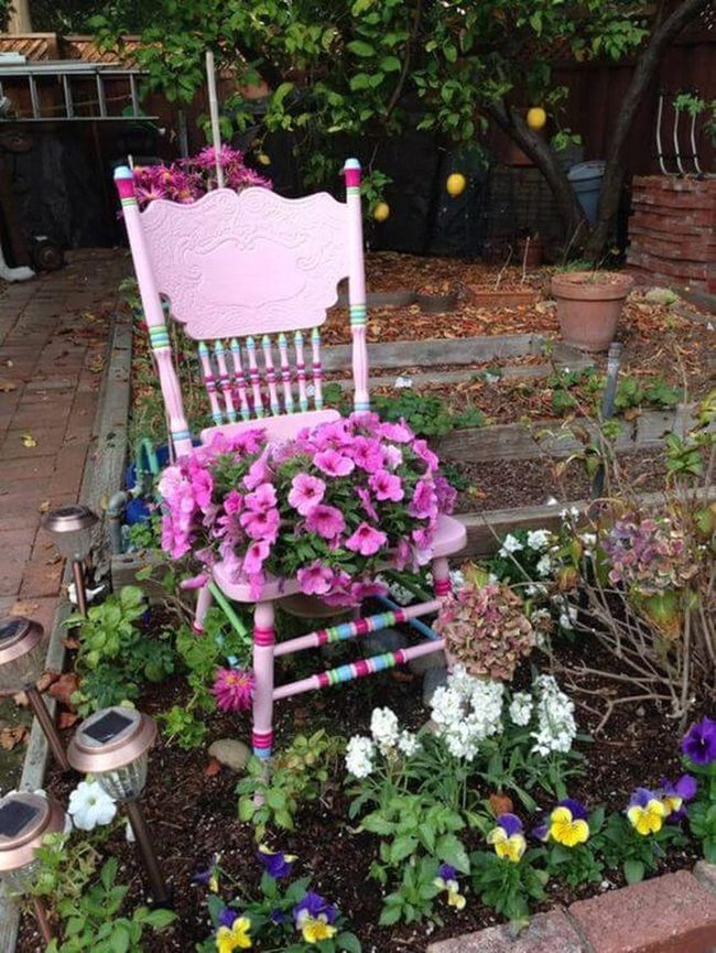 Painted Chair Overflowing With Flowers