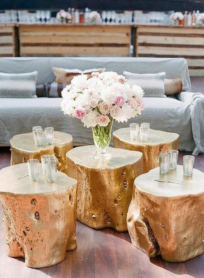 Golden Tree Stump Tables With Pink Flowers