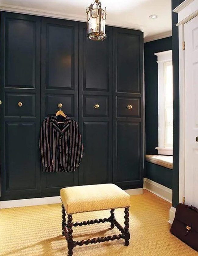 Dark Blue Cabinets With Golden Hardware