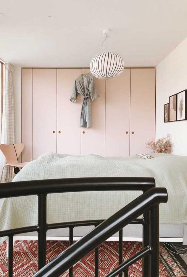 Soft Pink Bedroom With Striped Pendant