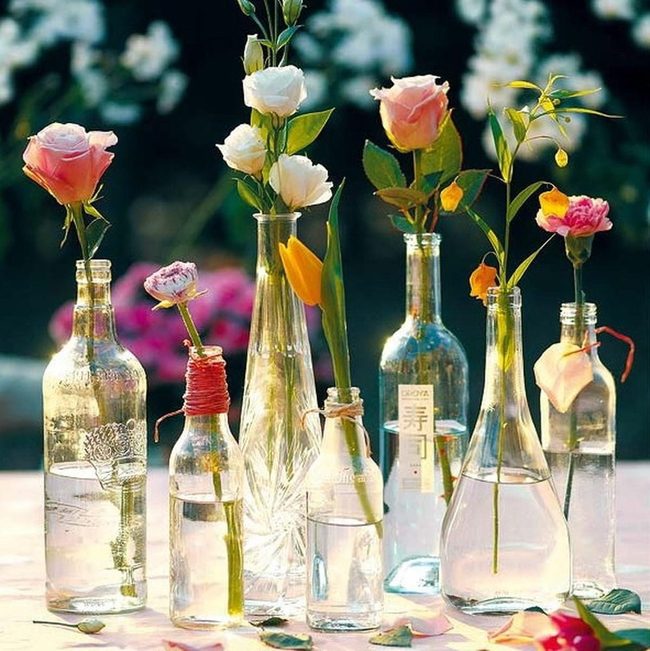 Transparent Bottles Scattered Wildflowers