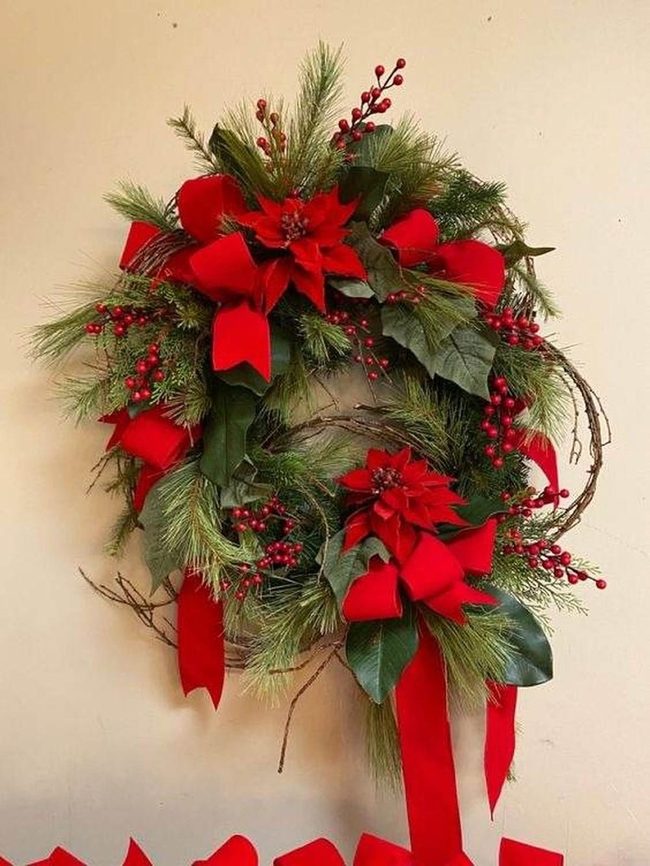 Red Poinsettias And Pine Needles