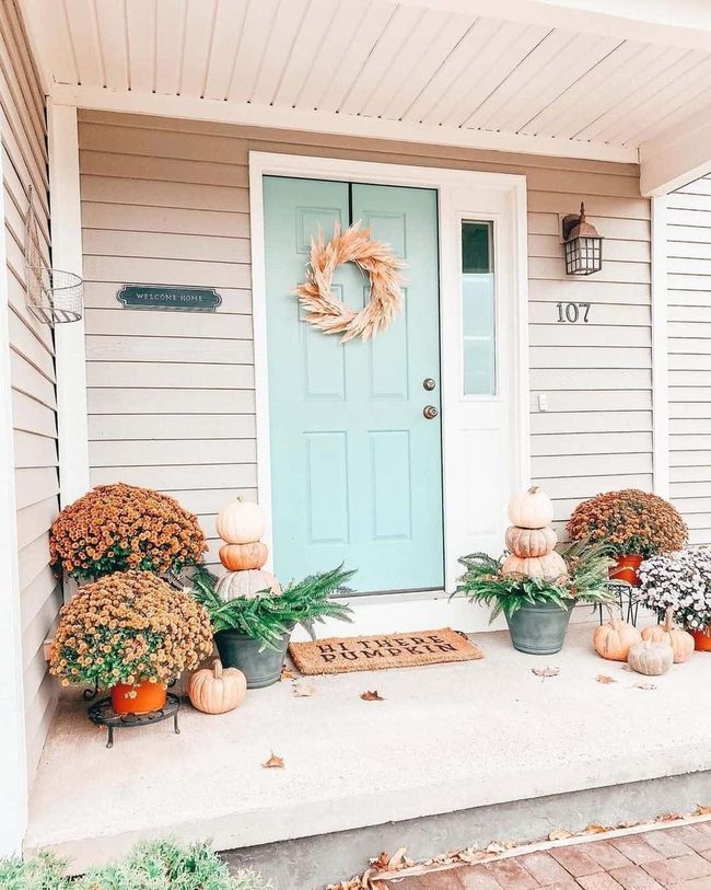 Straw Wreath Meets Bright Orange Mums