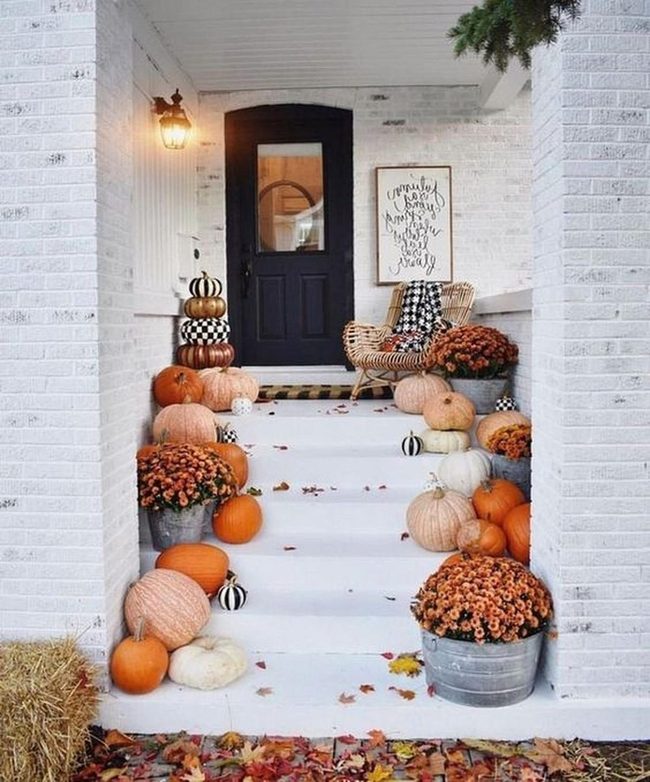 White Brick Porch With Striped Pumpkins